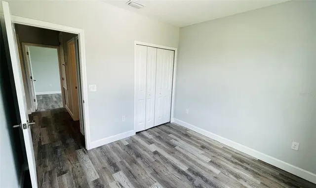 a view of an empty room and a window