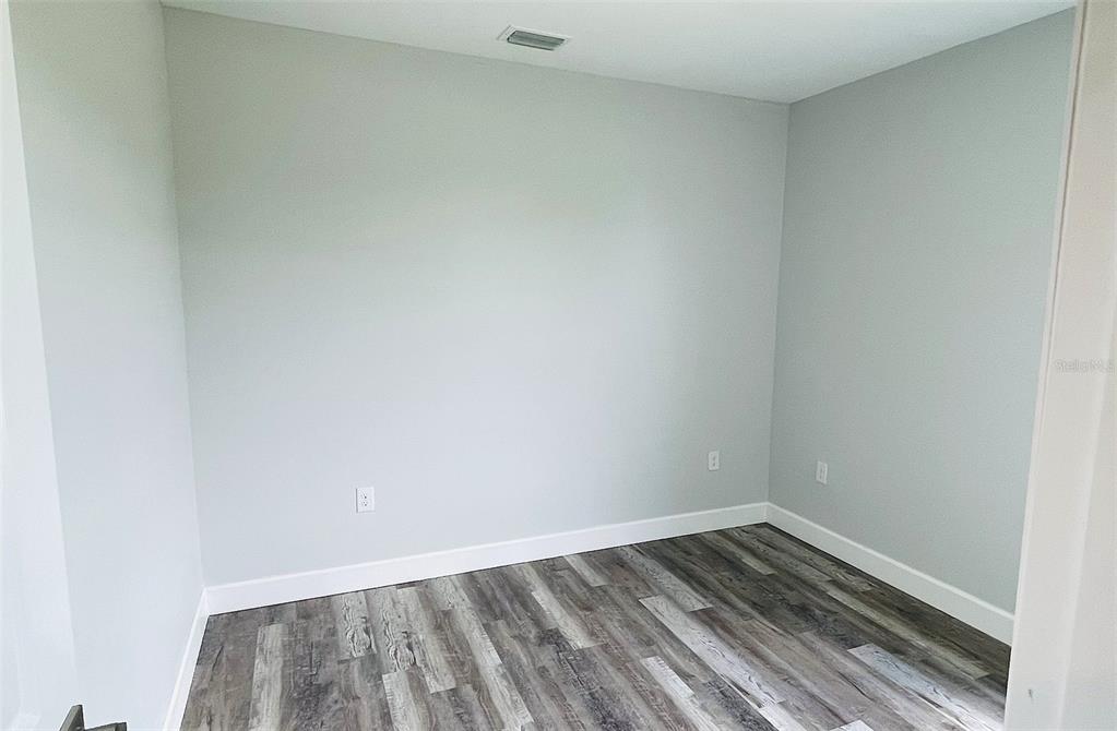 12258 Henley Avenue, Unit B Port Charlotte, FL 33981 - Photo 27 of 39 a view of wooden floor