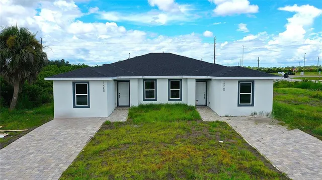 front view of a house with a yard