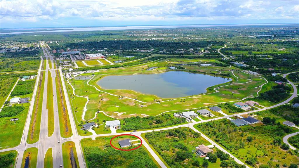 12258 Henley Avenue, Unit B Port Charlotte, FL 33981 - Photo 6 of 39 a view of an outdoor space pool patio and lake view