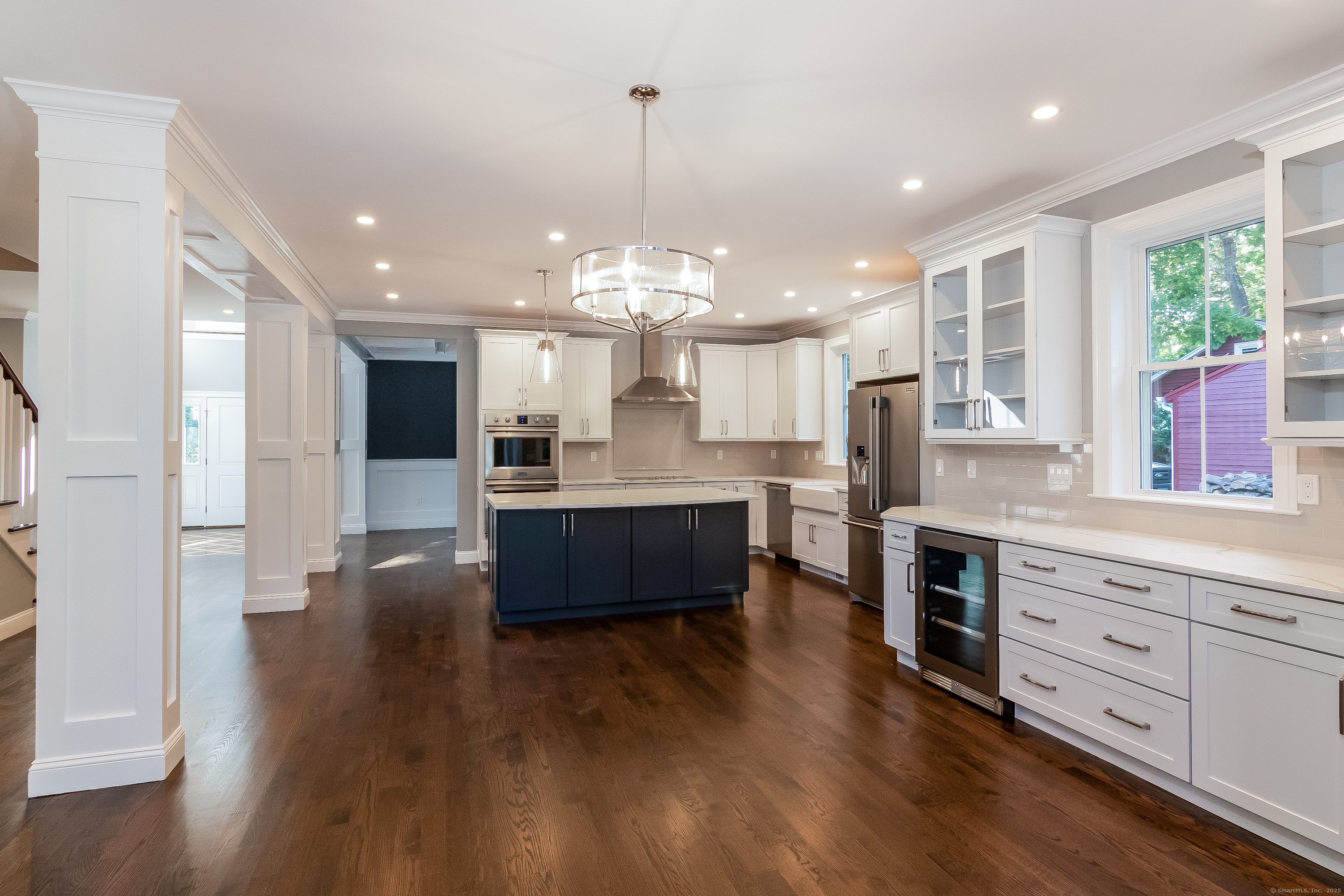 11 Buttonball Road Old Lyme, CT 06371 - Photo 11 of 38 a large kitchen with stainless steel appliances kitchen island a large counter top and wooden floors