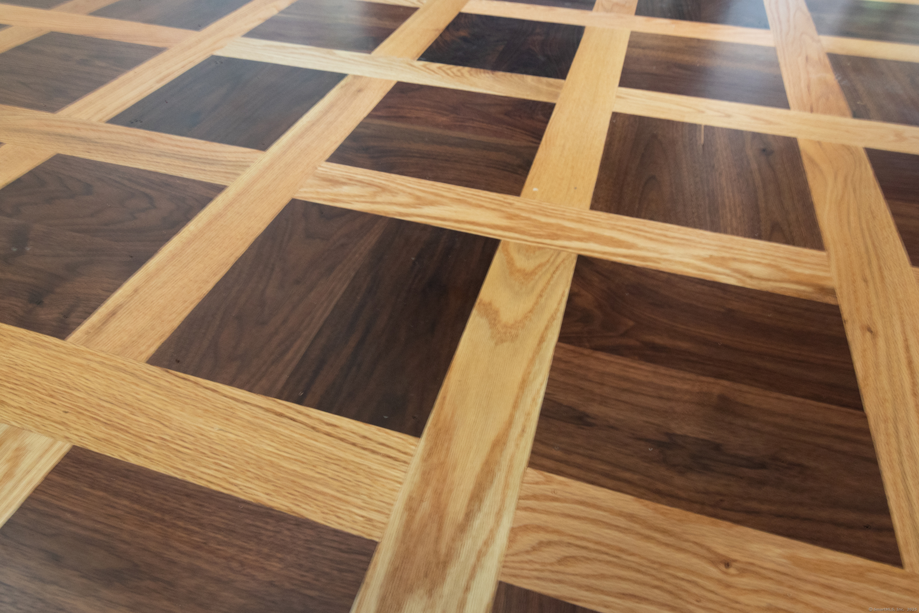 11 Buttonball Road Old Lyme, CT 06371 - Photo 17 of 38 Close up of the inlaid wood in the foyer of a previous build.