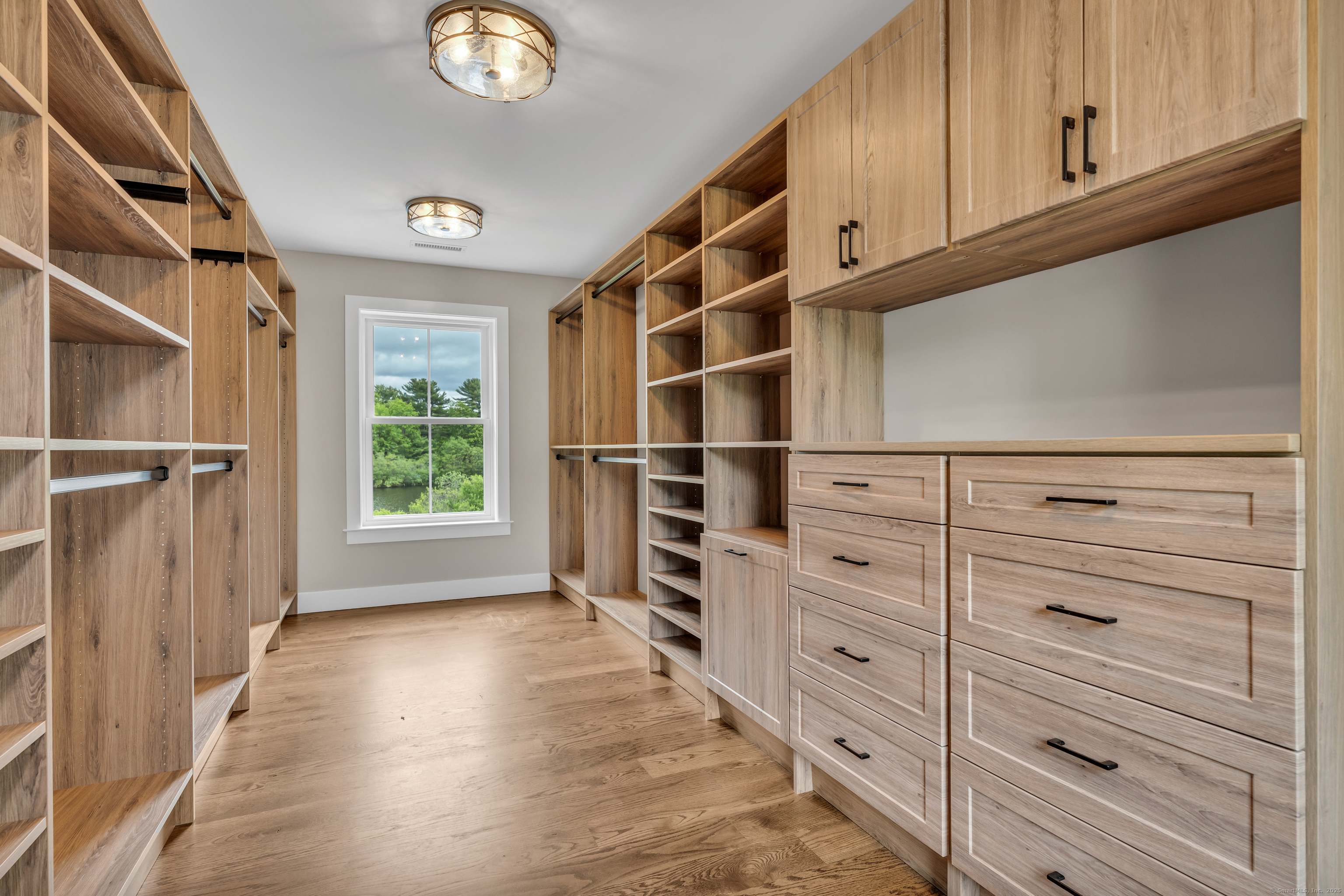11 Buttonball Road Old Lyme, CT 06371 - Photo 25 of 38 a view of walk in closet with empty racks