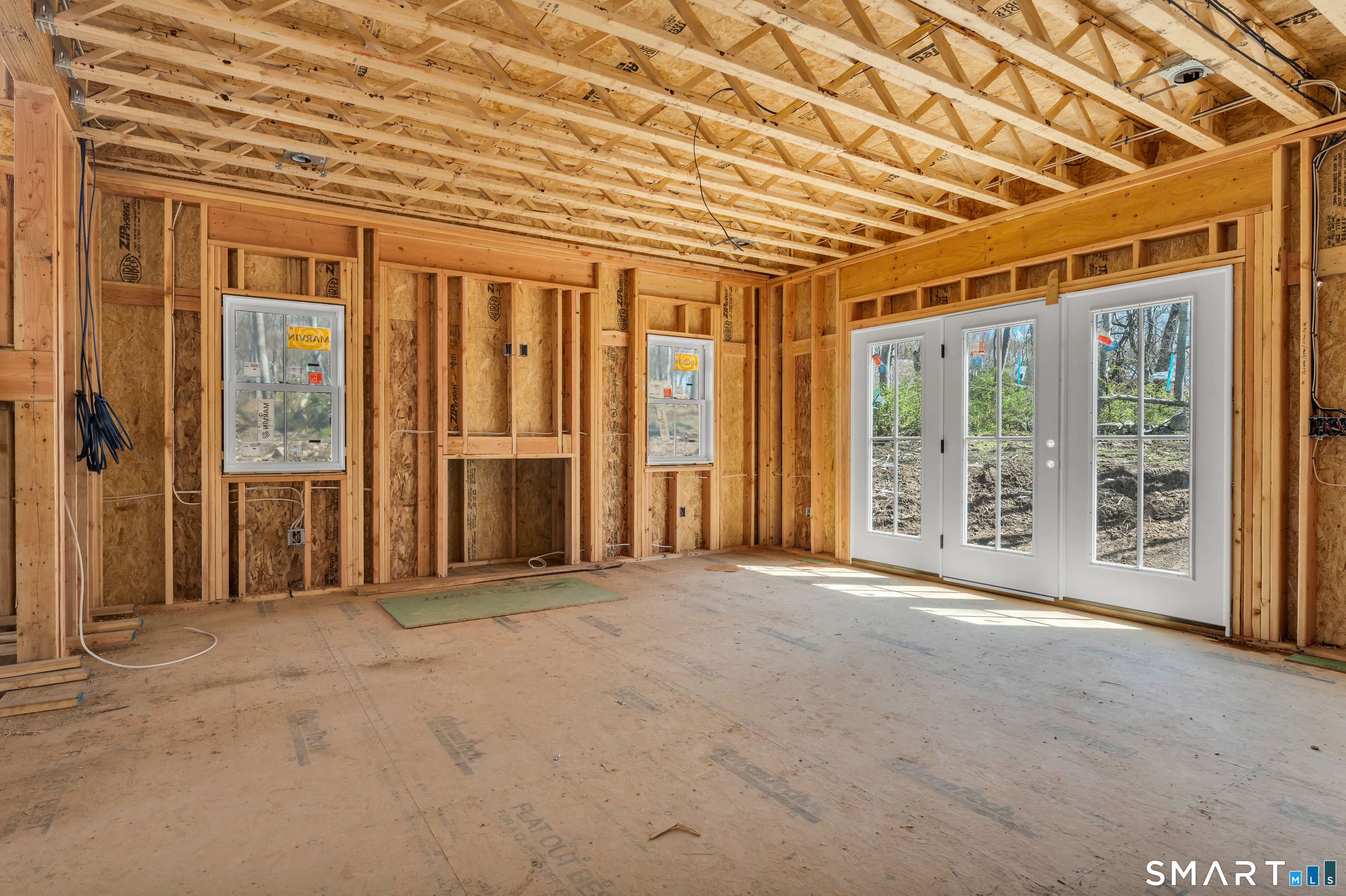 11 Buttonball Road Old Lyme, CT 06371 - Photo 6 of 40 View from the future kitchen toward the family room. Note the french doors bringing in plenty of light!