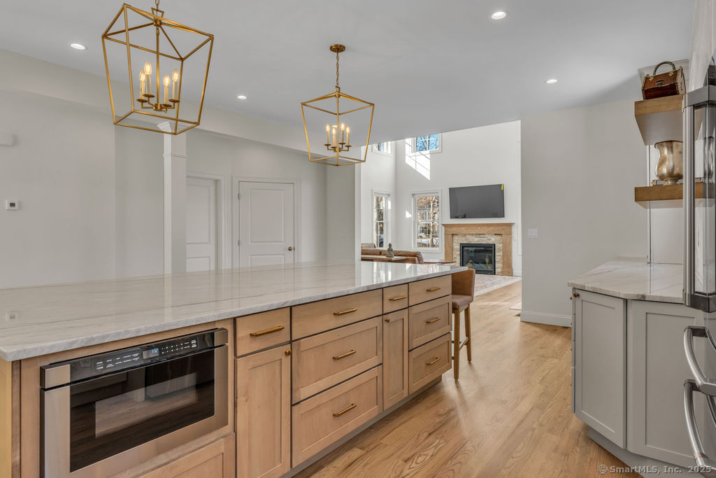 11 Buttonball Road Old Lyme, CT 06371 - Photo 10 of 40 Example of a kitchen with white perimeter cabinets and wood island. Wood? Color? Design the kitchen of your dreams!