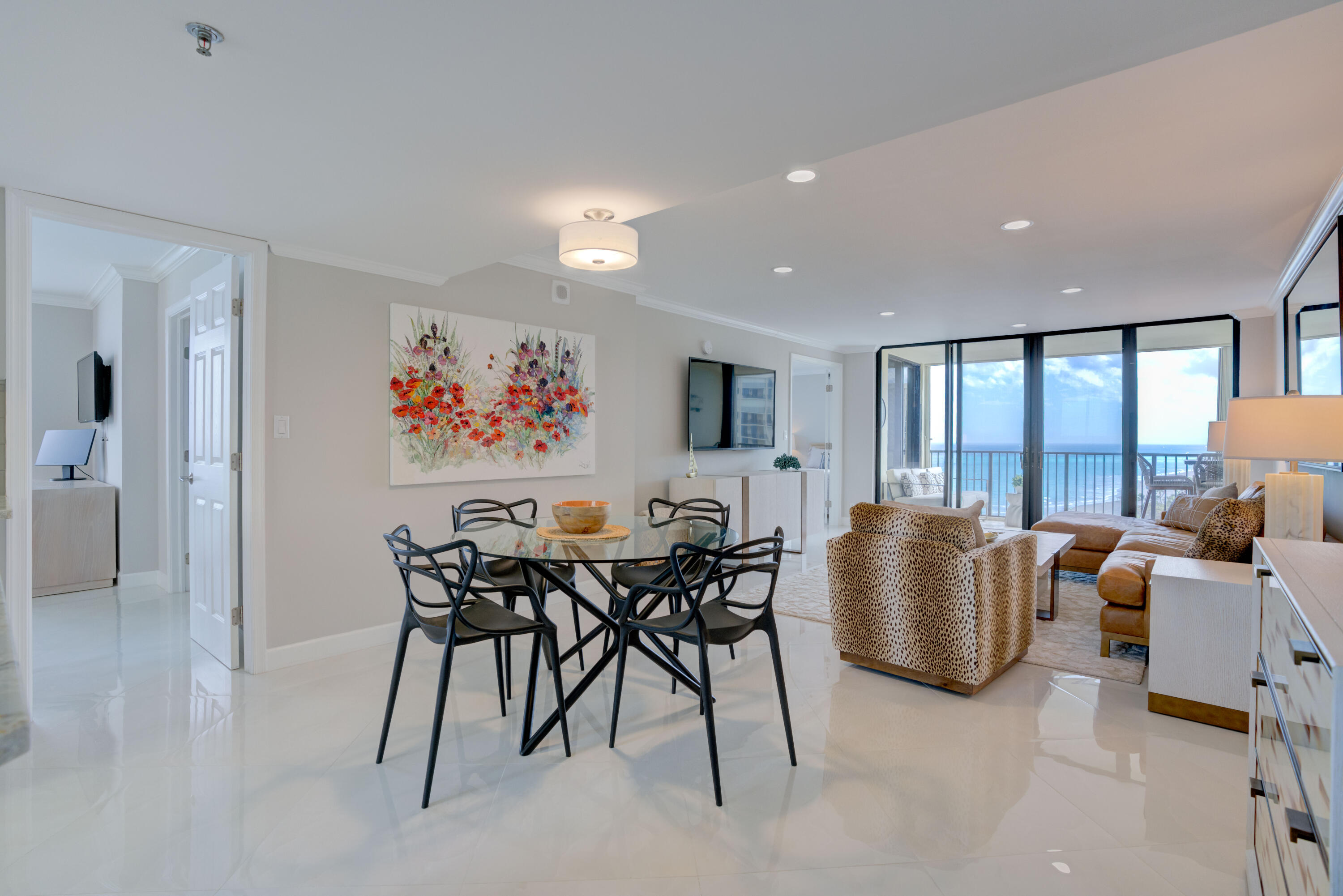 200 Ocean Trail Way, Unit 910 Jupiter, FL 33477 - Photo 11 of 16 a dining room with furniture and a floor to ceiling window