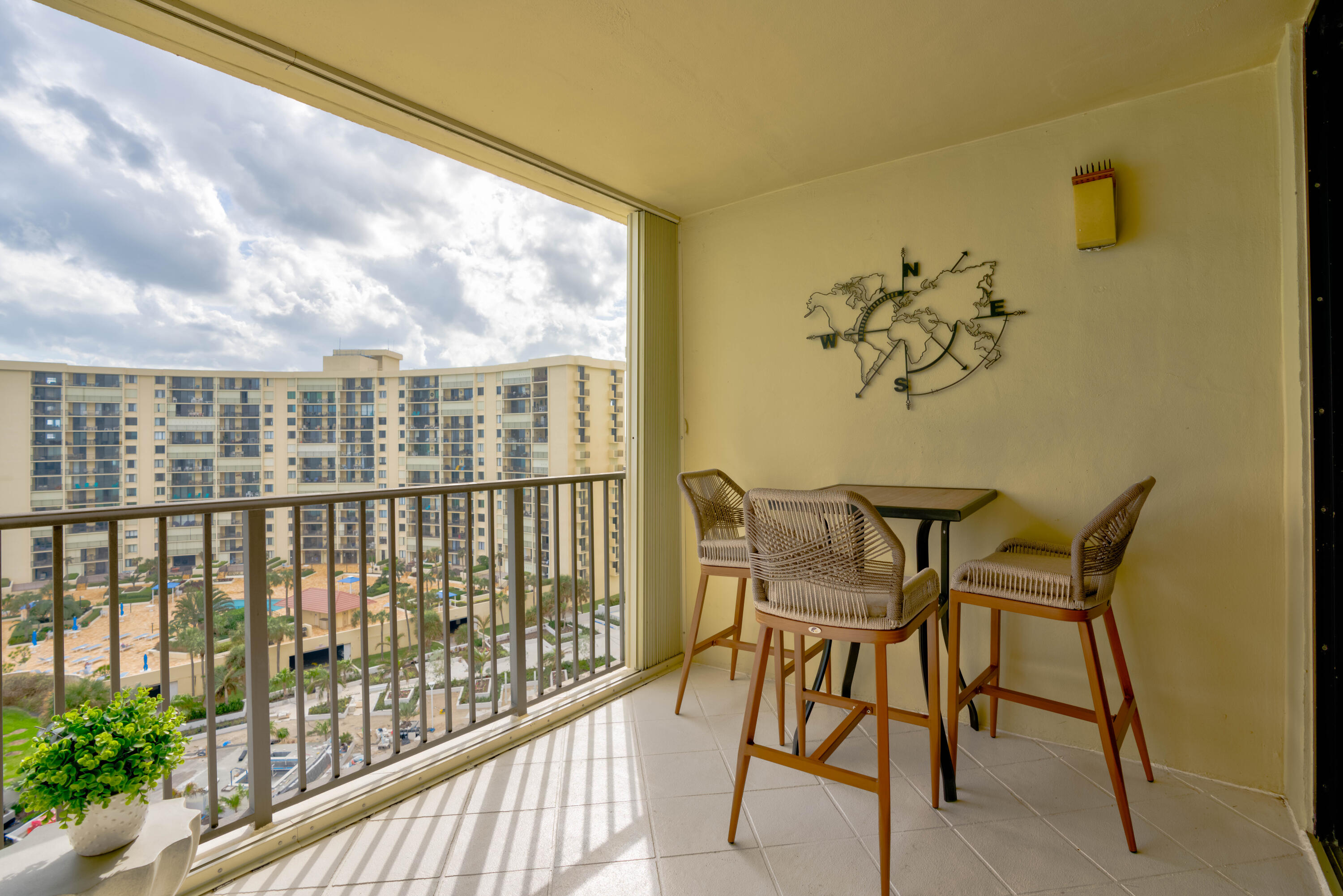 200 Ocean Trail Way, Unit 910 Jupiter, FL 33477 - Photo 16 of 16 a view of a chairs and table in the balcony