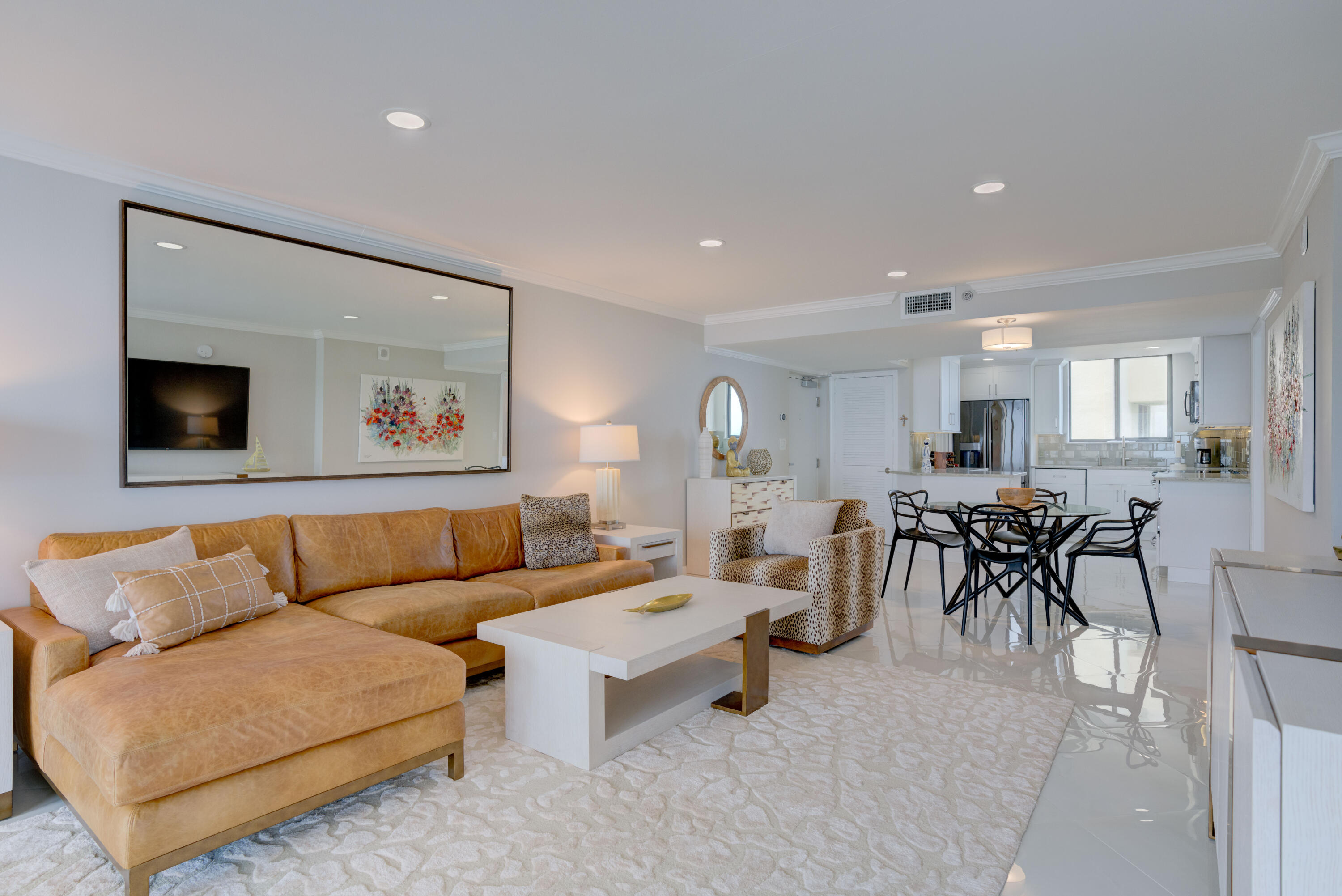 200 Ocean Trail Way, Unit 910 Jupiter, FL 33477 - Photo 10 of 16 a living room with furniture and a flat screen tv