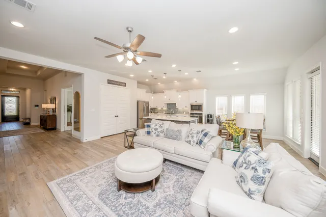 a living room with furniture and a large window