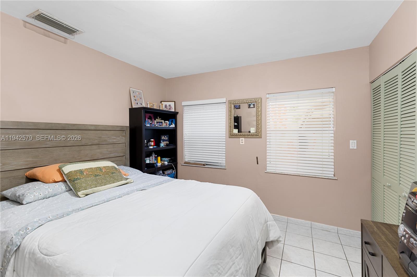 2818 Southwest 2nd Street Miami, FL 33135 - Photo 16 of 47 a bedroom with a bed and a window