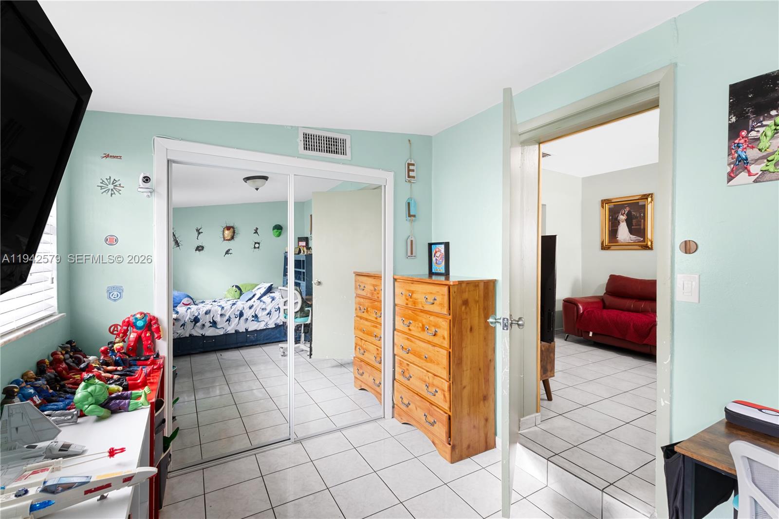 2818 Southwest 2nd Street Miami, FL 33135 - Photo 18 of 47 a bedroom with furniture and flowers