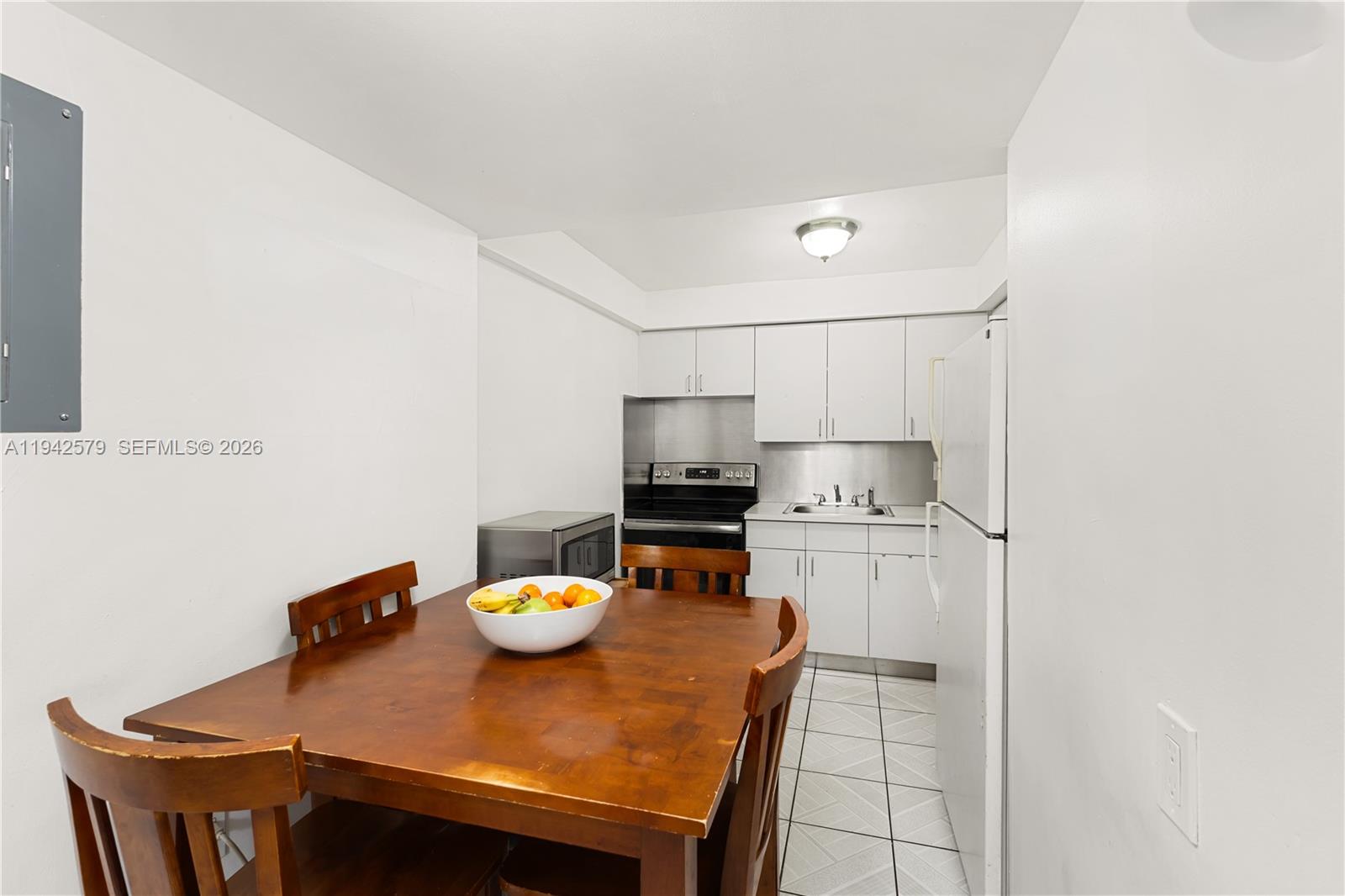 2818 Southwest 2nd Street Miami, FL 33135 - Photo 26 of 47 a kitchen with a table and chairs