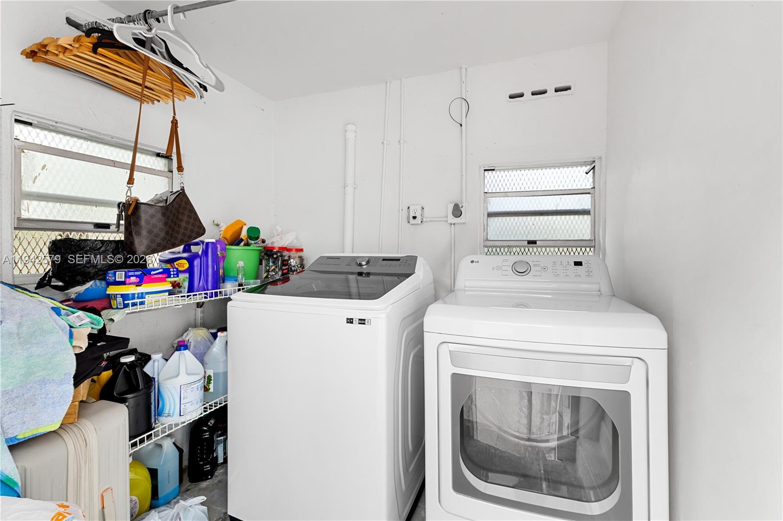 2818 Southwest 2nd Street Miami, FL 33135 - Photo 36 of 47 a utility room with dryer and washer