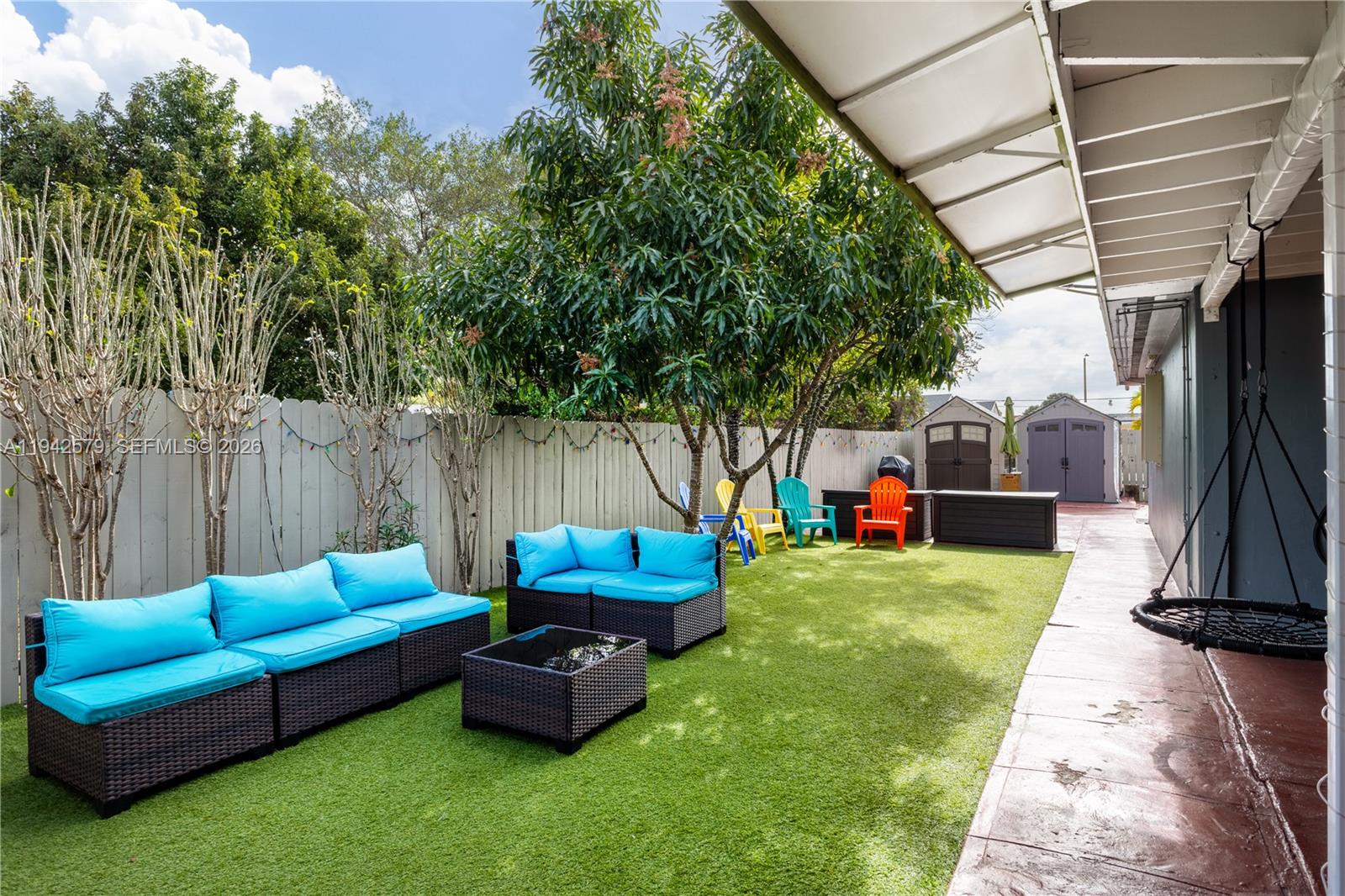 2818 Southwest 2nd Street Miami, FL 33135 - Photo 39 of 47 a backyard of a house with table and chairs