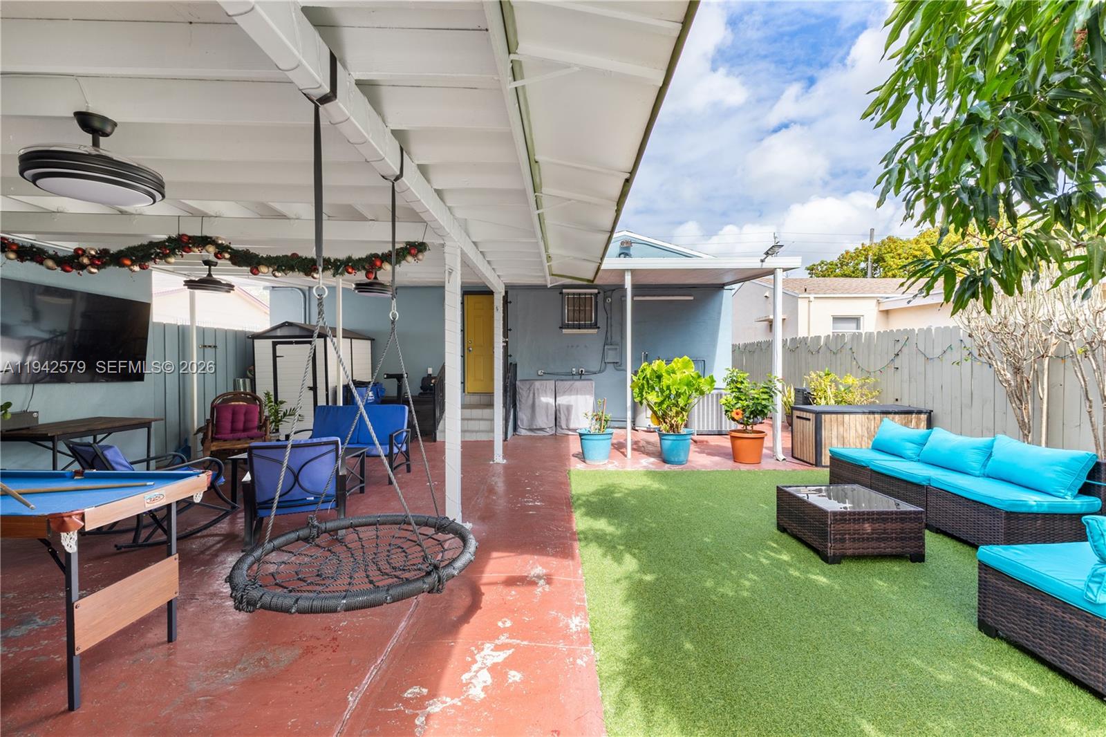 2818 Southwest 2nd Street Miami, FL 33135 - Photo 41 of 47 a living room with patio furniture and a wooden floor