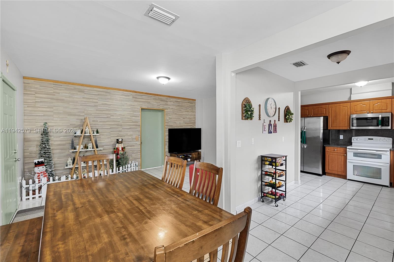 2818 Southwest 2nd Street Miami, FL 33135 - Photo 8 of 47 a living room with furniture and a flat screen tv