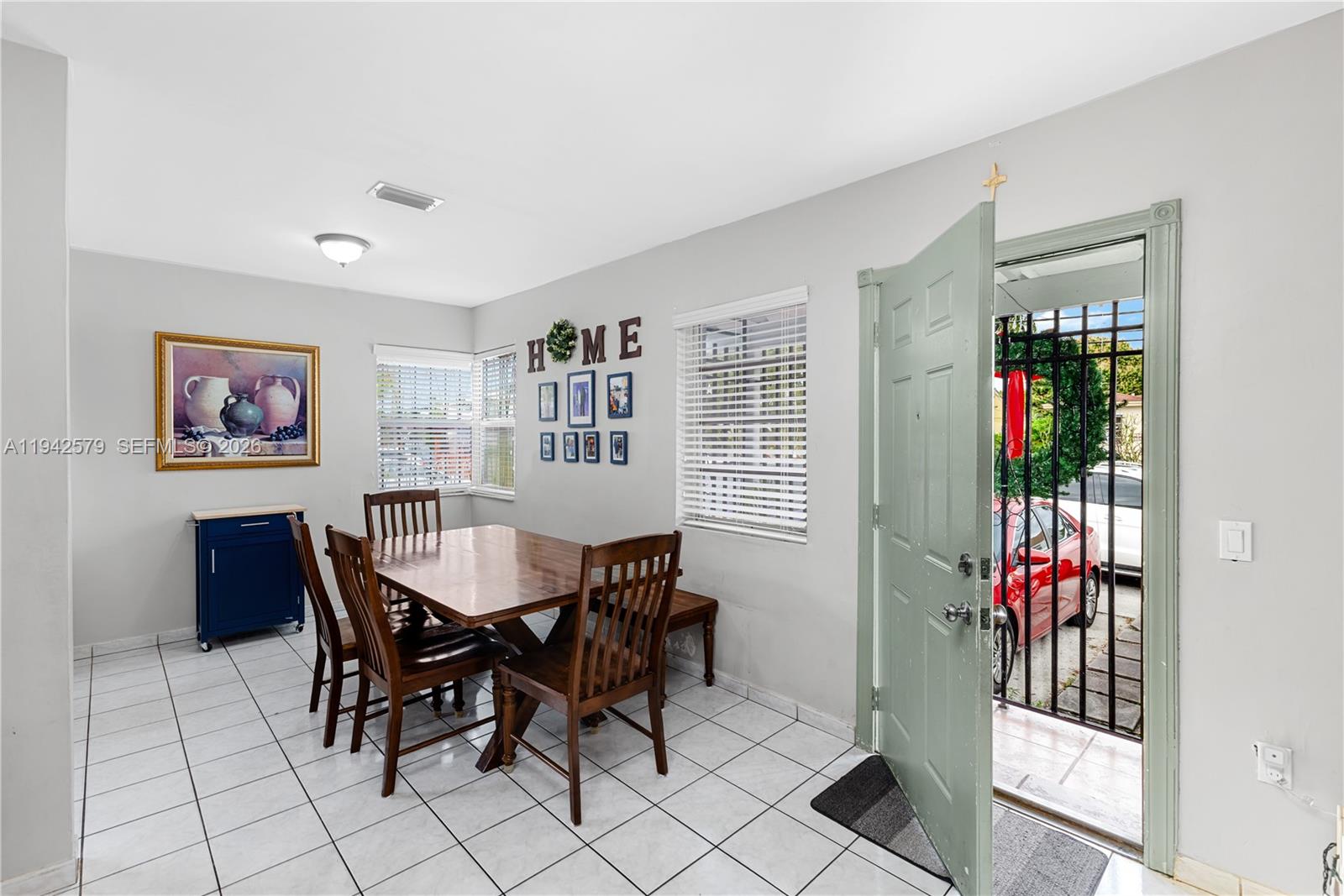 2818 Southwest 2nd Street Miami, FL 33135 - Photo 9 of 47 a view of a dining room with furniture window and wooden floor