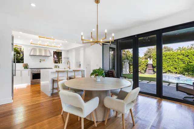 a bathroom with a sink a mirror and a shower