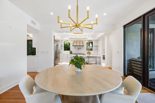a kitchen with stainless steel appliances granite countertop a stove and a refrigerator