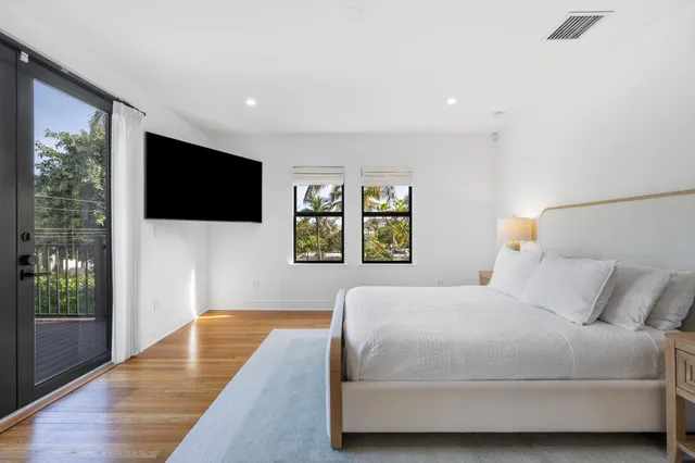 a bathroom with a sink a mirror and a view of a bathroom