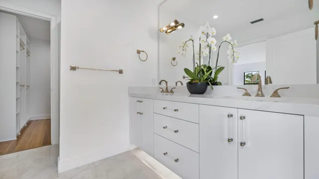 an empty room with wooden floor and window