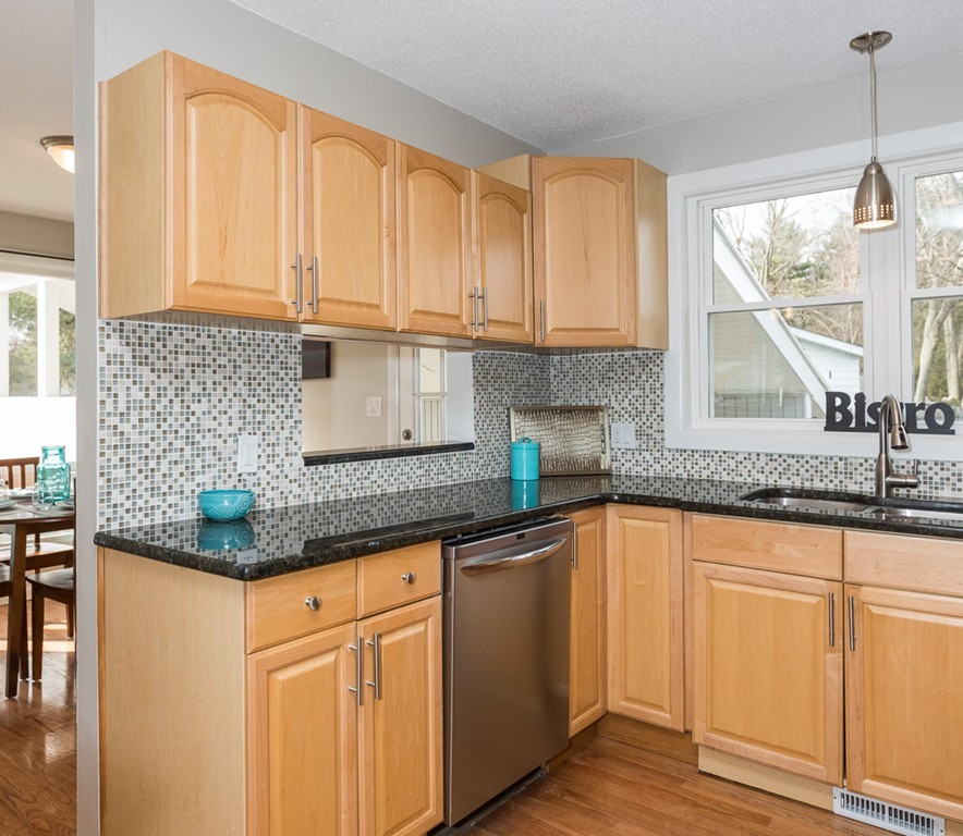 54 Ellendale Circle Springfield, MA 01128 - Photo 13 of 27 a kitchen with granite countertop white cabinets and a sink