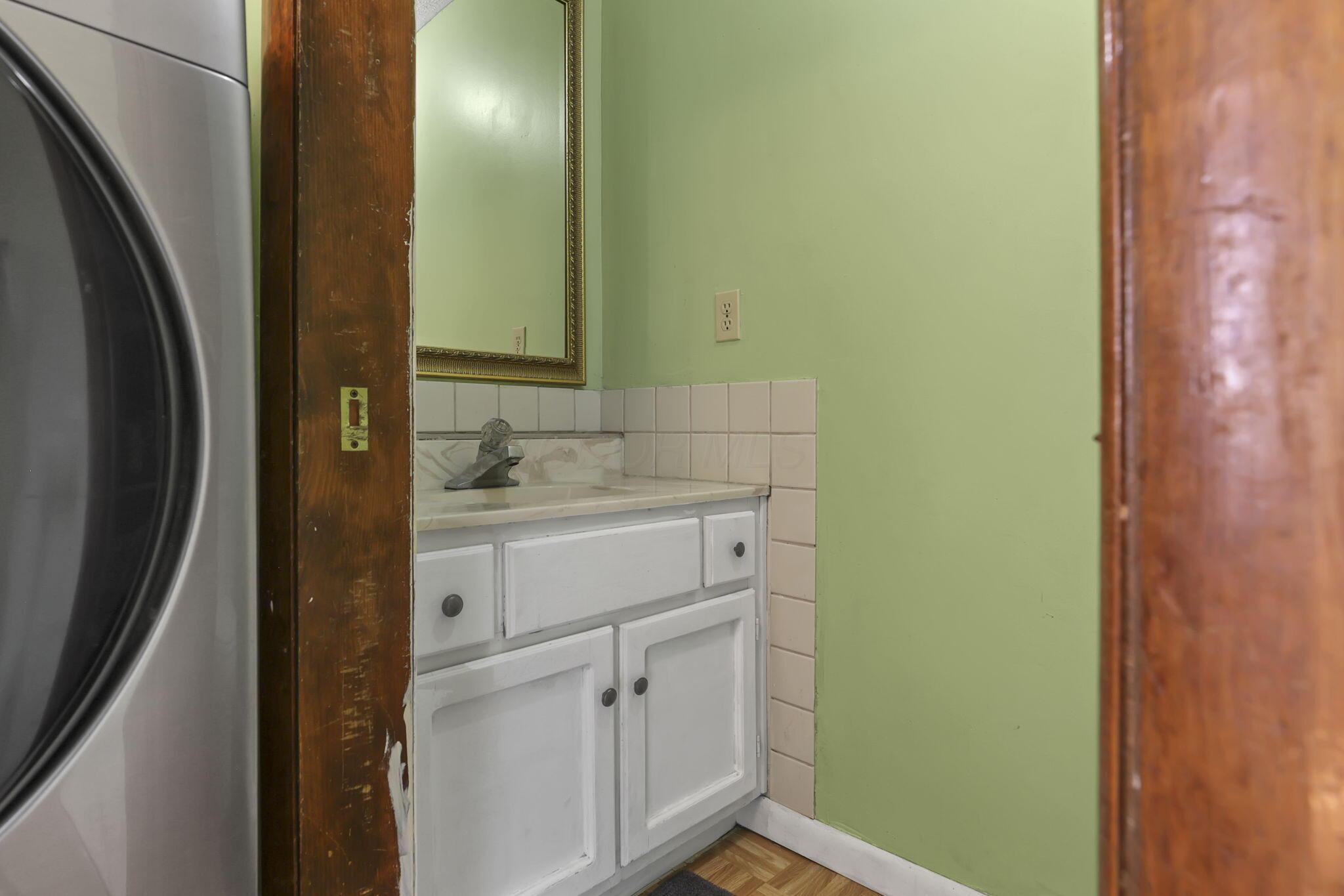 6605 Lancaster Road Hebron, OH 43025 - Photo 13 of 53 Half bath conveintly located off kitchen and laundry room