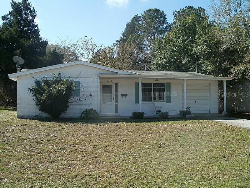 6200 Silver Drive New Port Richey, FL 34653 - Photo 1 of 1 a house that has a tree in front of it