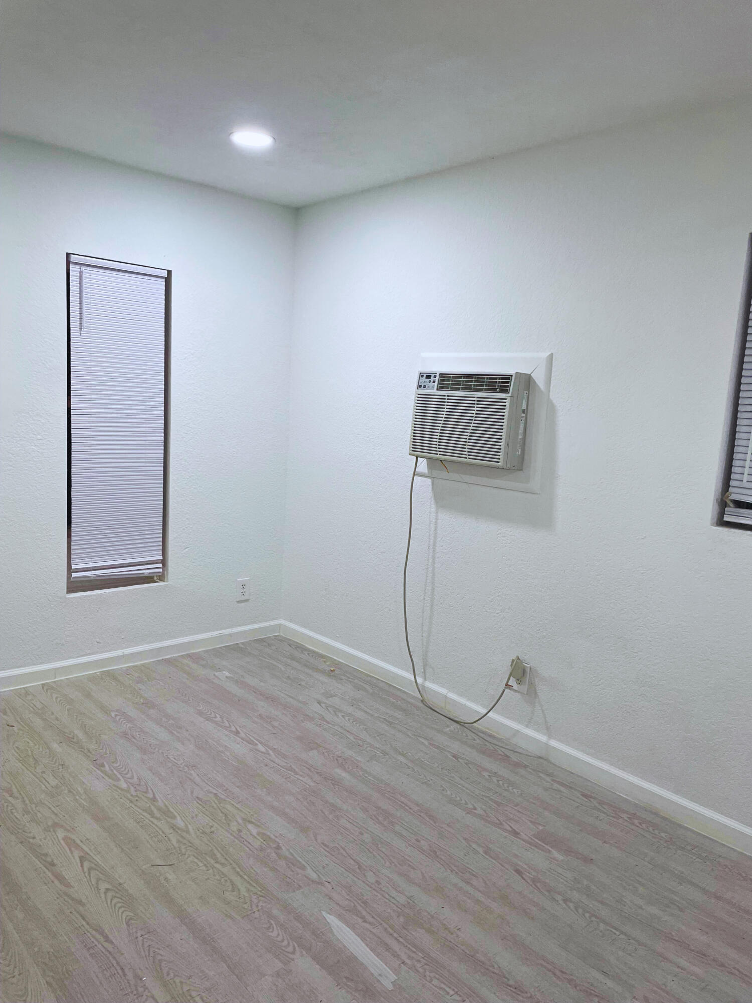 1340 West 33rd Street Riviera Beach, FL 33404 - Photo 13 of 18 a view of a room with wooden floor and window