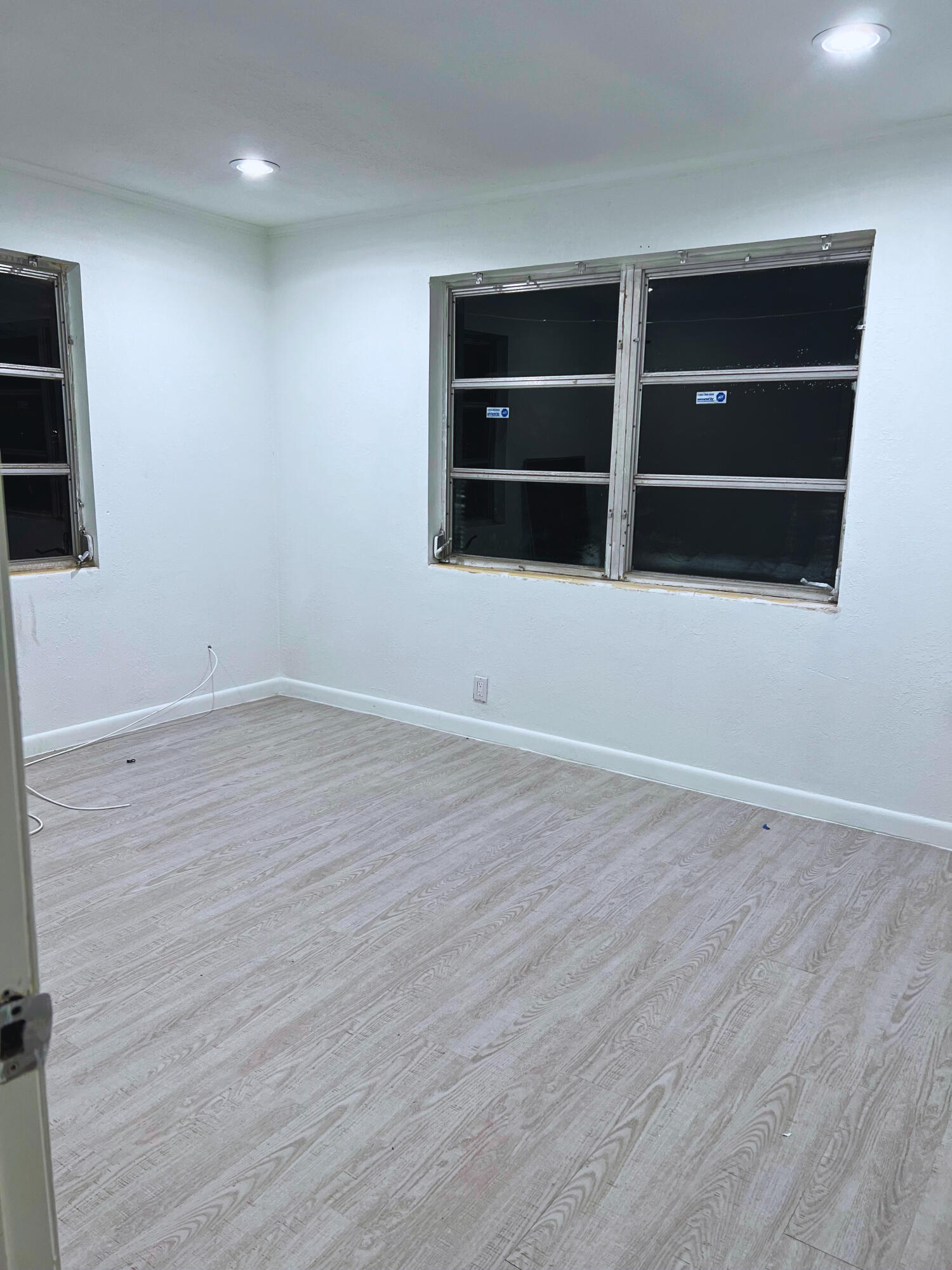 1340 West 33rd Street Riviera Beach, FL 33404 - Photo 9 of 18 a view of an empty room with wooden floor and closet