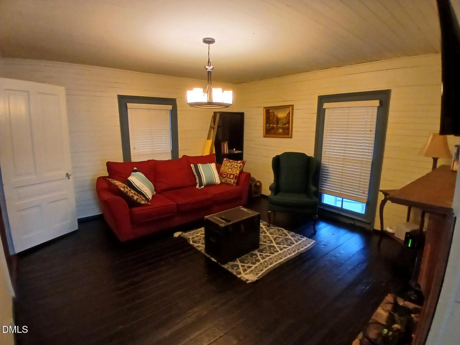 1920 Kelly Road Apex, NC 27502 - Photo 28 of 44 a living room with furniture and a wooden floor