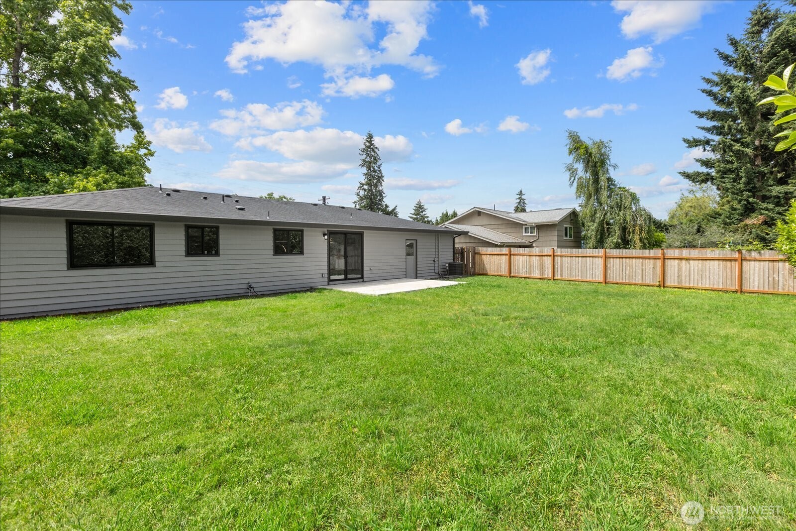 10646 Southeast 236th Street Kent, WA 98031 - Photo 18 of 20 a front view of a house with a garden