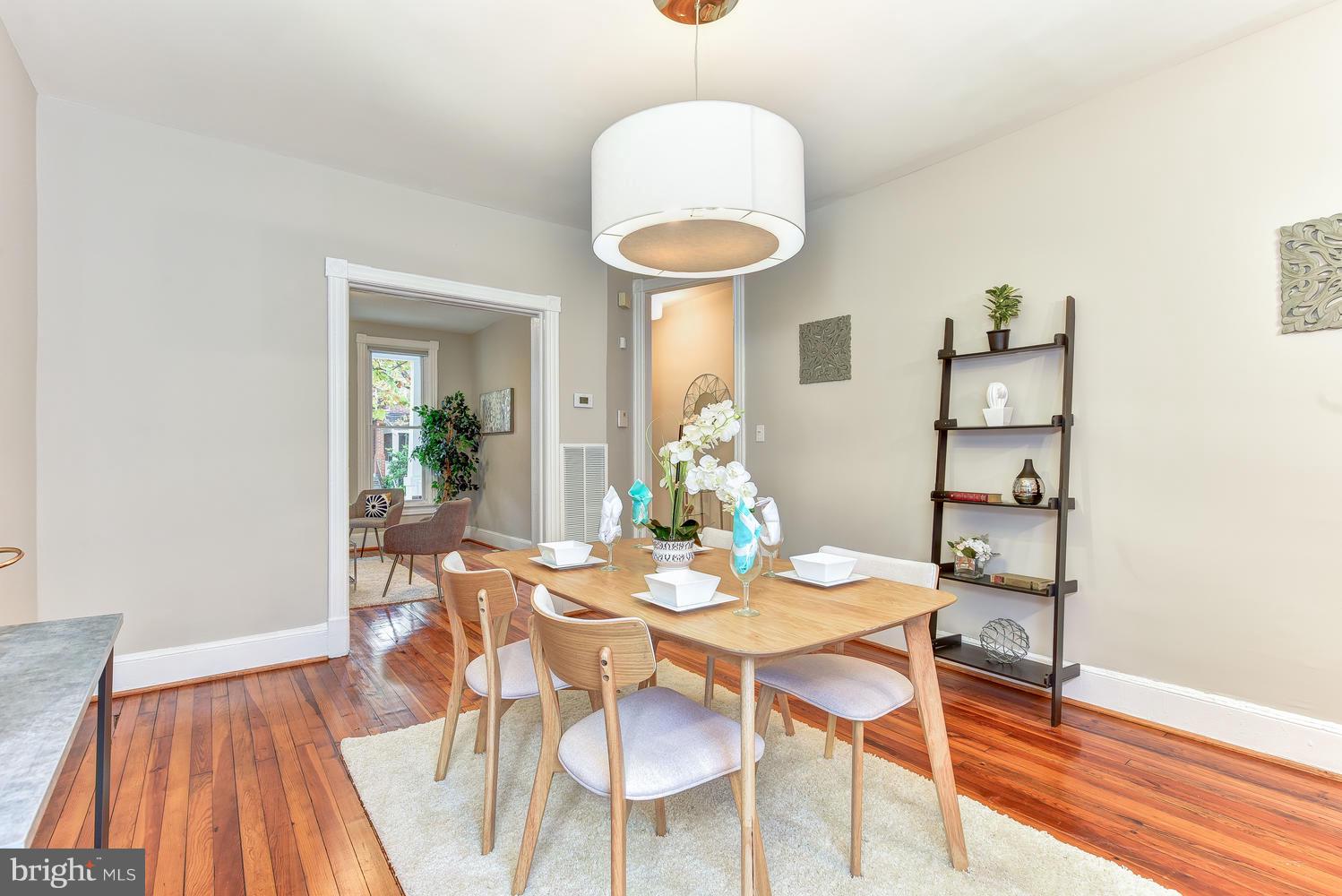 610 Columbia Road Northwest Washington, DC 20001 - Photo 6 of 29 a view of a dining room with furniture and wooden floor