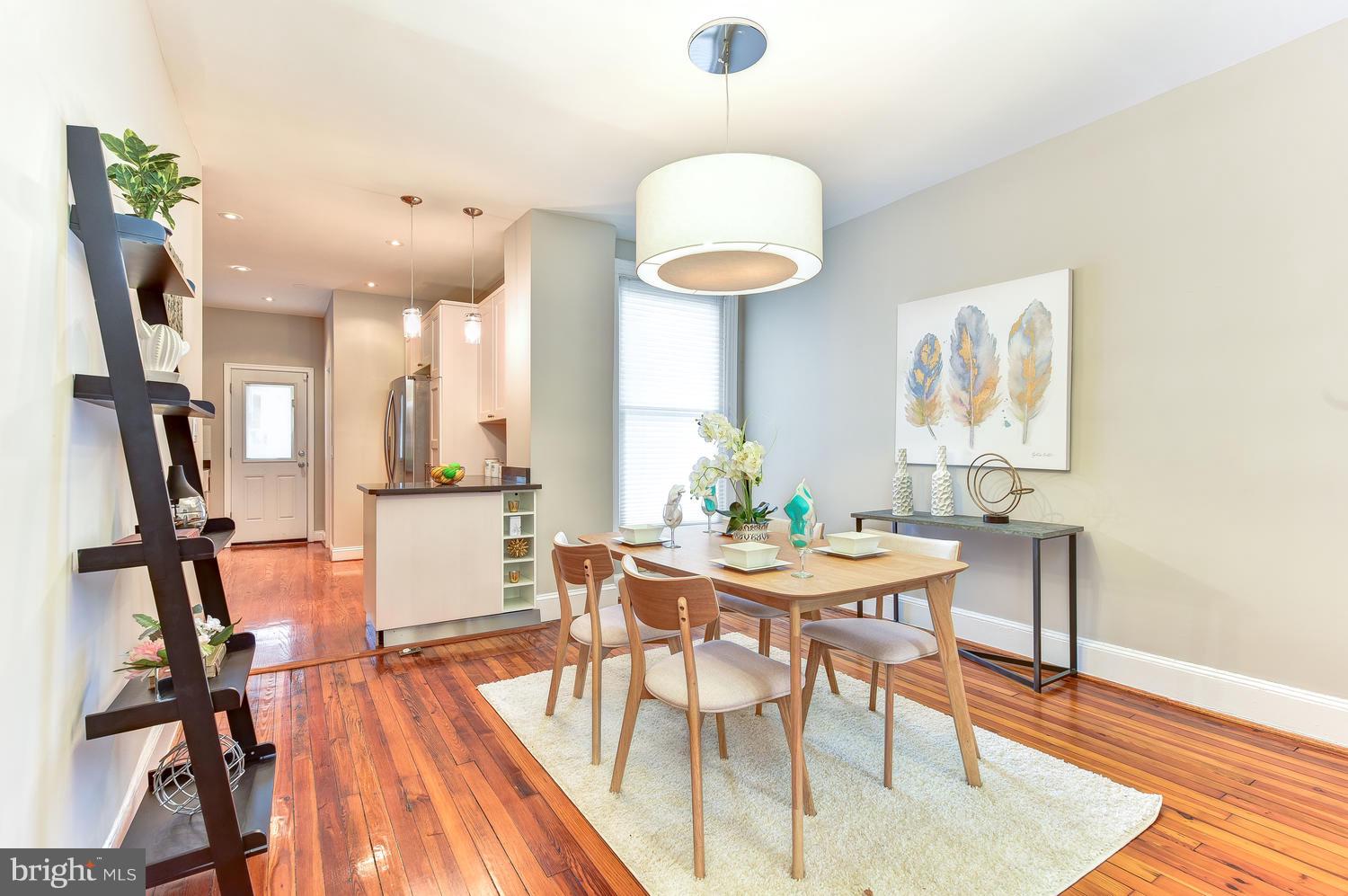 610 Columbia Road Northwest Washington, DC 20001 - Photo 7 of 29 a view of a dining room with furniture and wooden floor
