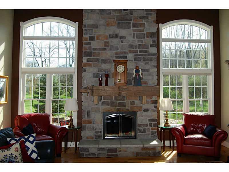 848 Bebout Road Venetia, PA 15367 - Photo 9 of 25 Great Room. Soaring fireplace, windows showcase view of rear yard with pond