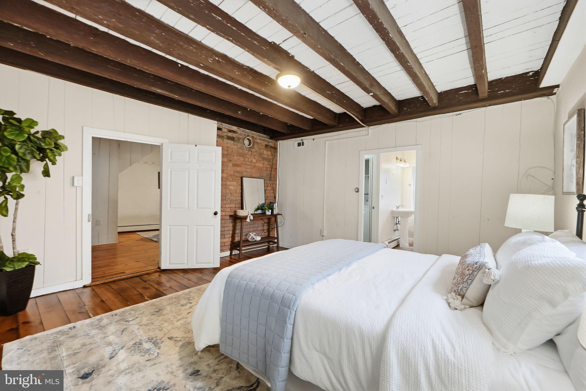 7456 Eylers Valley Flint Road Thurmont, MD 21788 - Photo 26 of 51 a bedroom with a bed and wooden floor