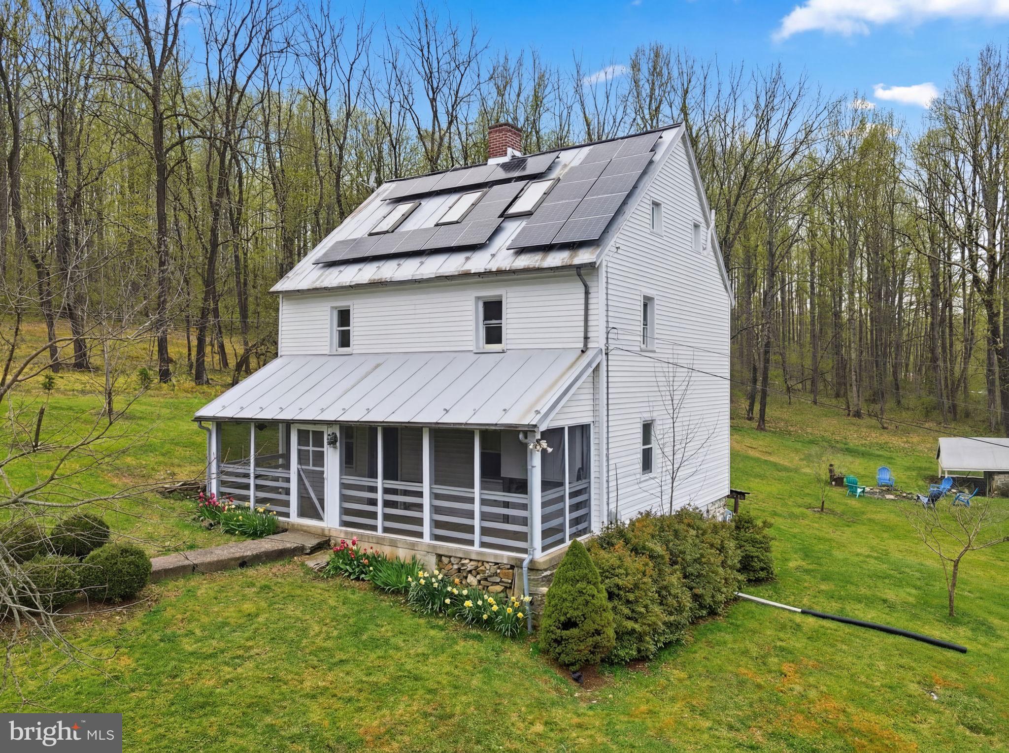 7456 Eylers Valley Flint Road Thurmont, MD 21788 - Photo 51 of 51 a aerial view of a house with a yard table and chairs