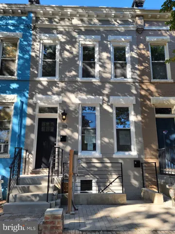 a front view of a building with glass windows