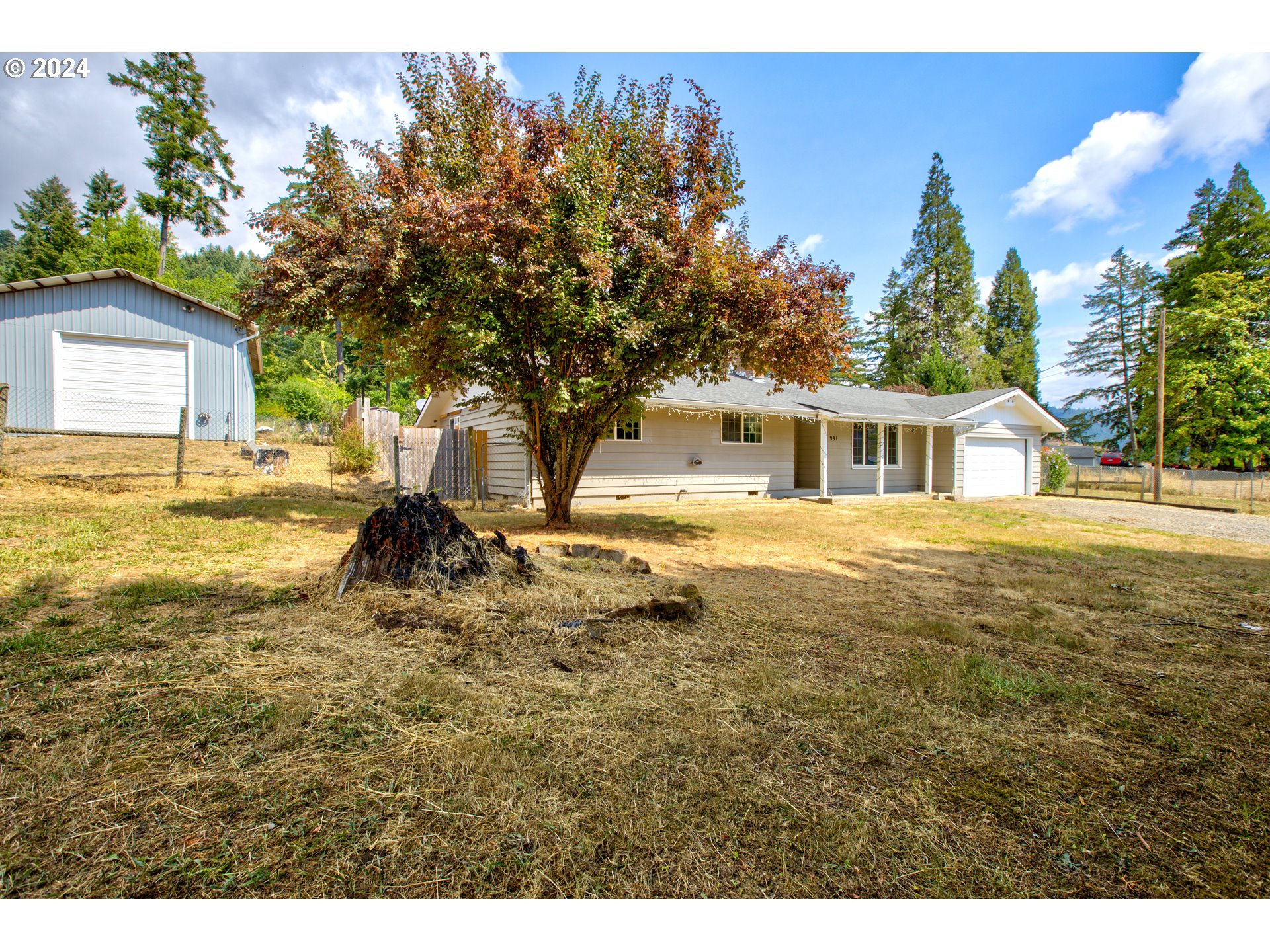 991 Mathis Hill Road Yoncalla, OR 97499 - Photo 42 of 42 a view of a house with a yard