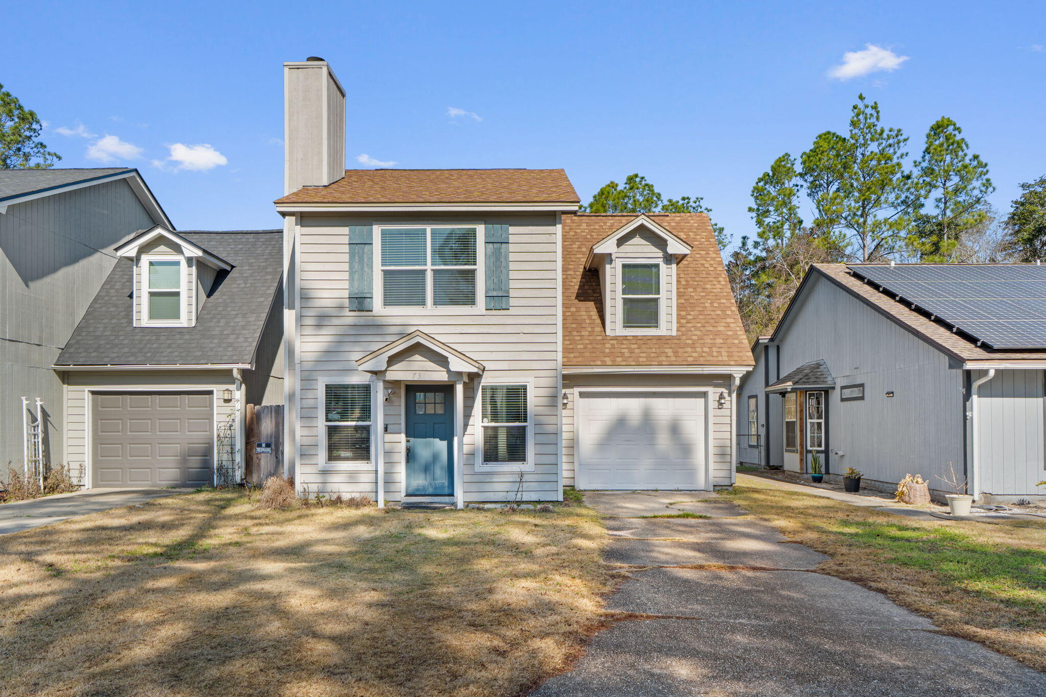 73 Kelly Way Valparaiso, FL 32580 - Photo 1 of 22 a front view of a house with a garden
