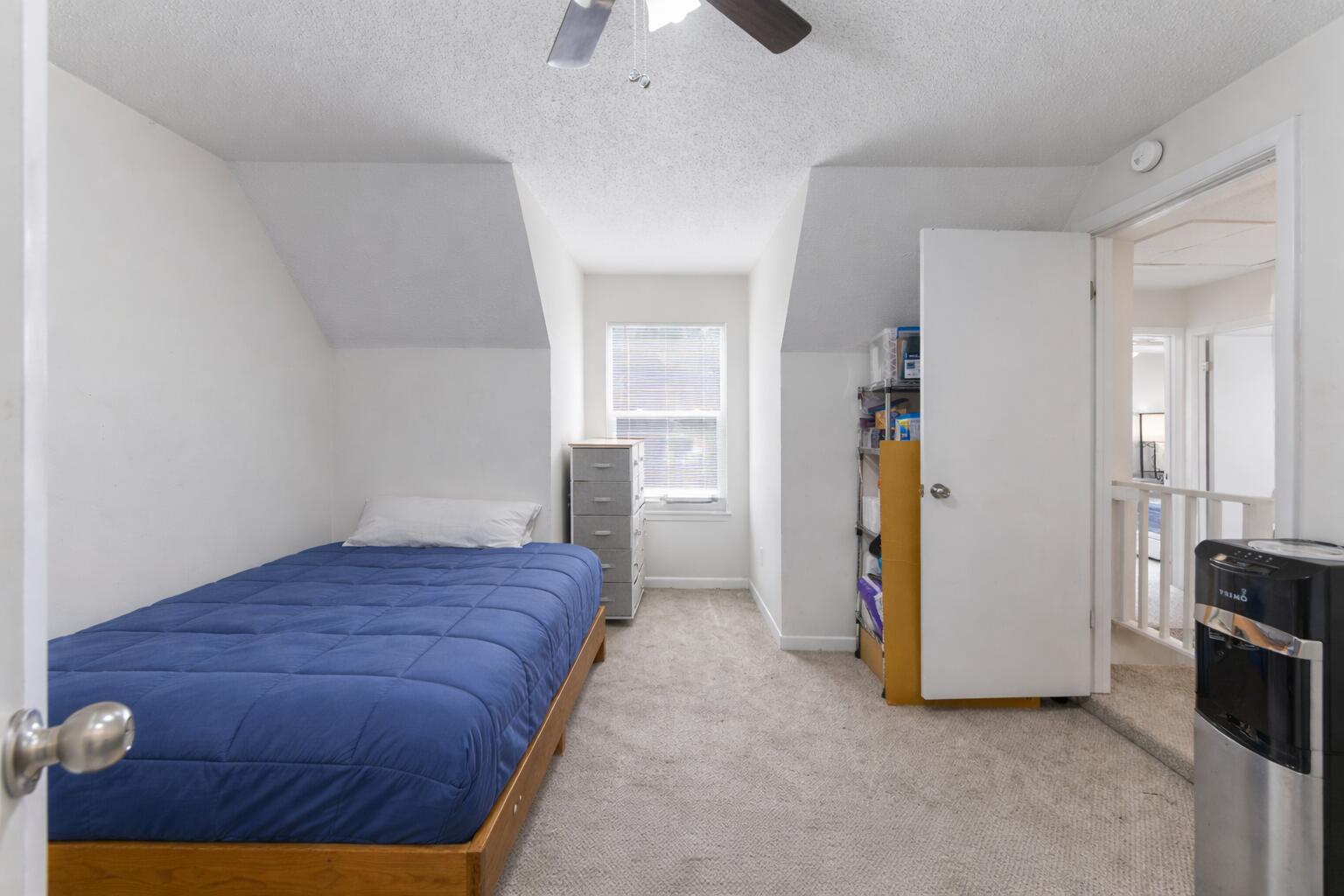 73 Kelly Way Valparaiso, FL 32580 - Photo 17 of 22 a bedroom with a bed and a chandelier