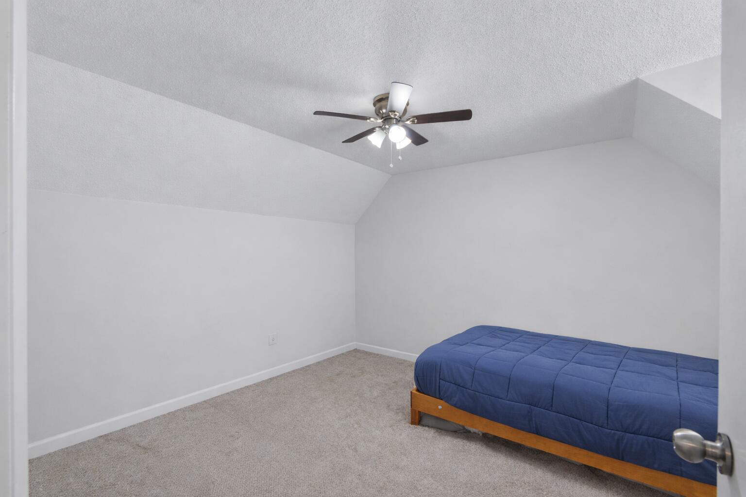 73 Kelly Way Valparaiso, FL 32580 - Photo 18 of 22 a room with a bed and a ceiling fan