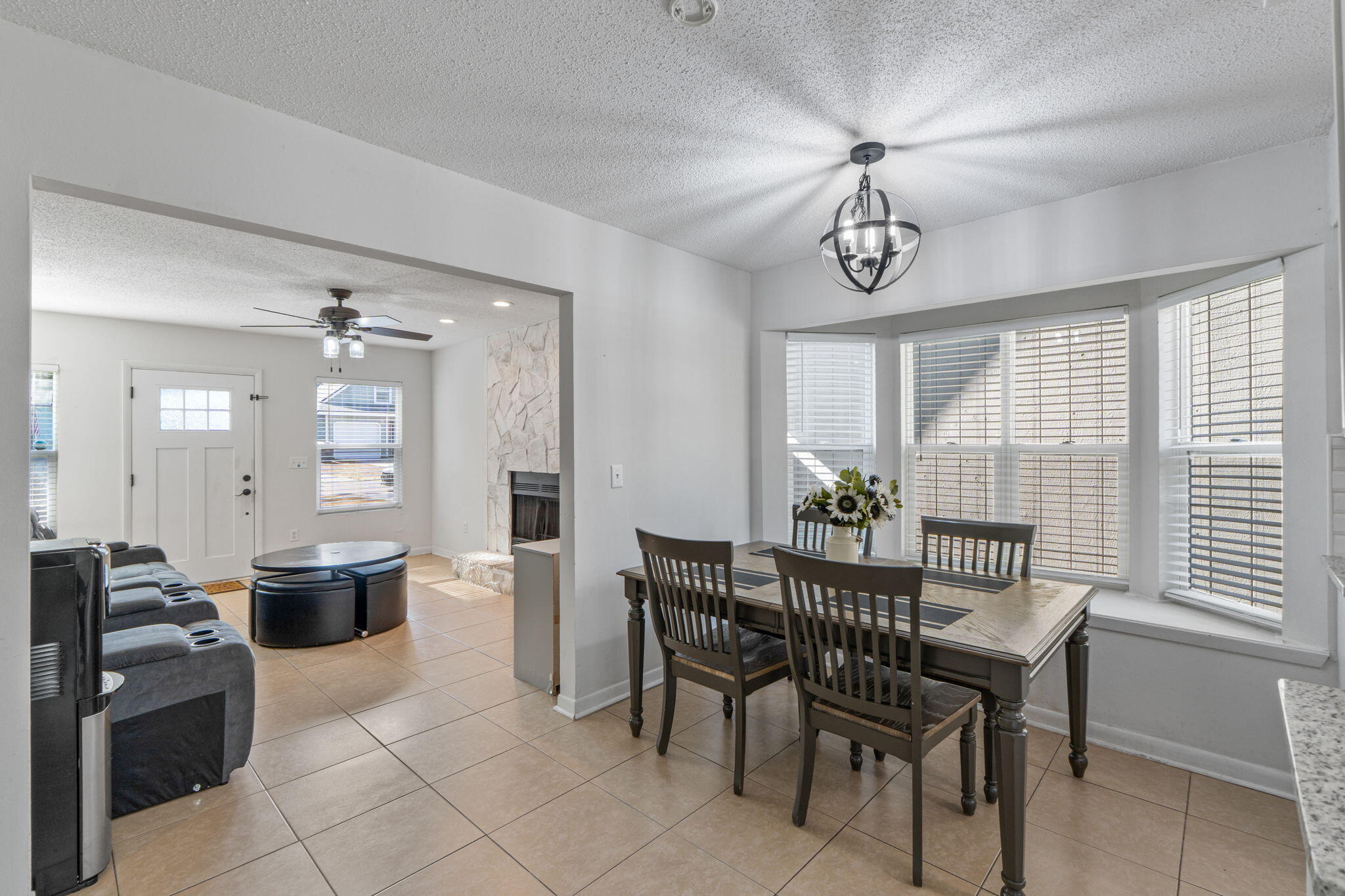 73 Kelly Way Valparaiso, FL 32580 - Photo 5 of 22 a view of a dining room with furniture wooden floor and chandelier