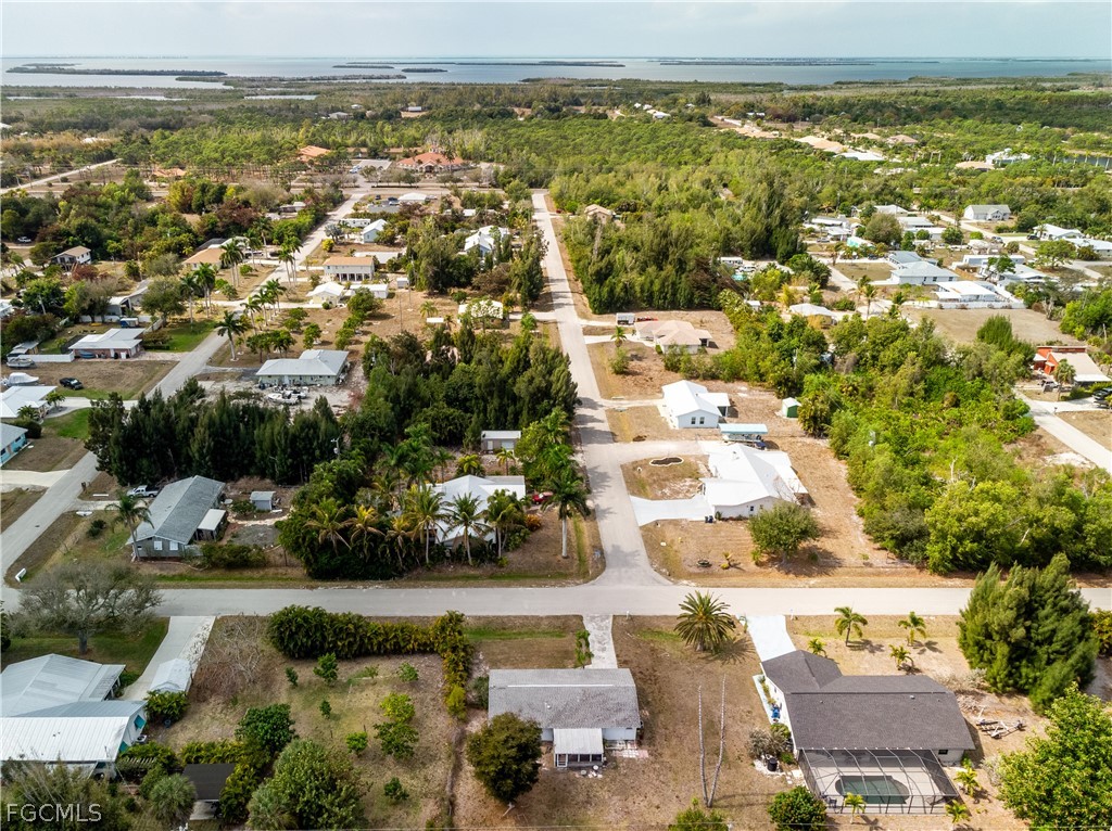 12170 Dolphin Road Bokeelia, FL 33922 - Photo 20 of 23 an aerial view of residential houses with outdoor space