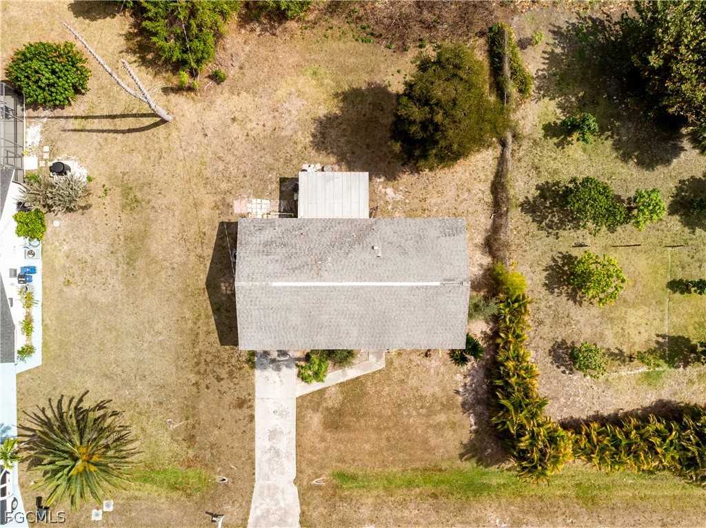 12170 Dolphin Road Bokeelia, FL 33922 - Photo 2 of 23 a bathroom with a sink and mirror