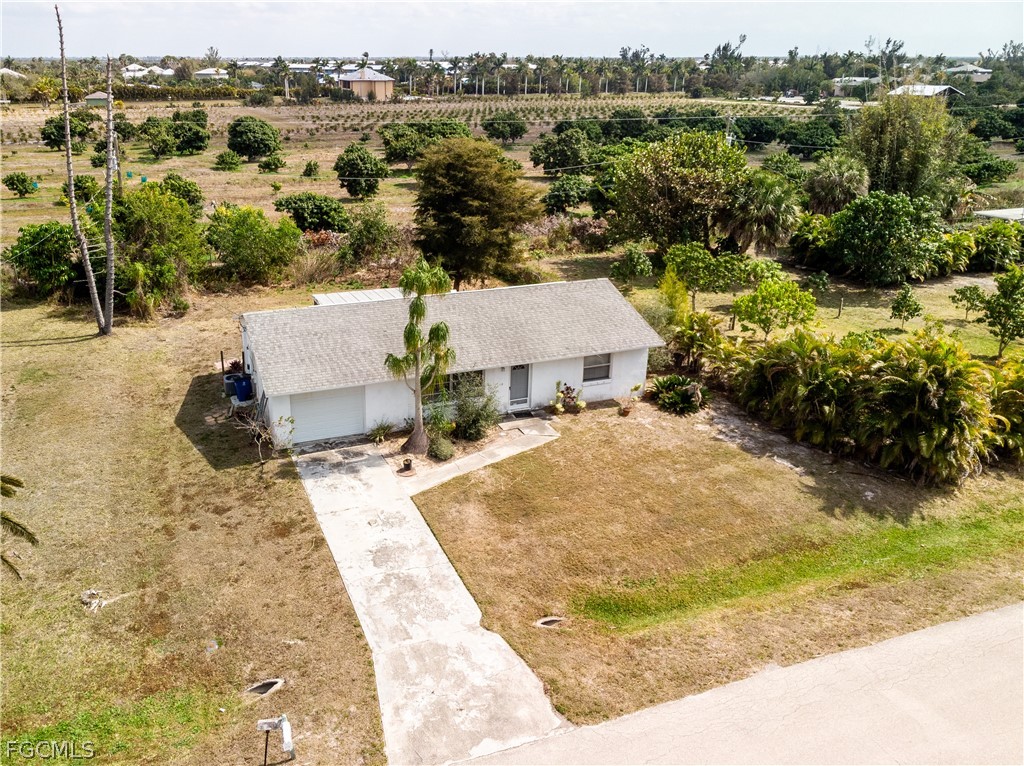 12170 Dolphin Road Bokeelia, FL 33922 - Photo 23 of 23 an aerial view of a house with a yard and lake view