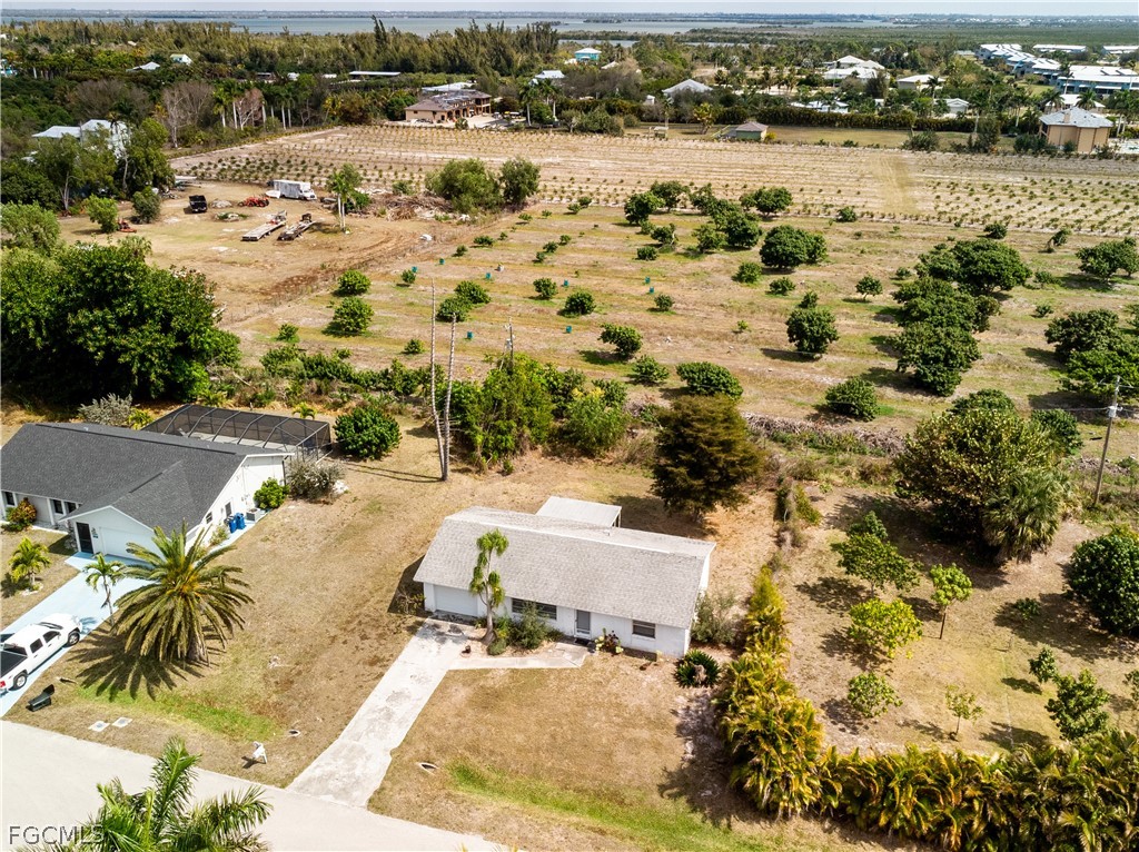 12170 Dolphin Road Bokeelia, FL 33922 - Photo 3 of 23 an aerial view of residential houses with outdoor space