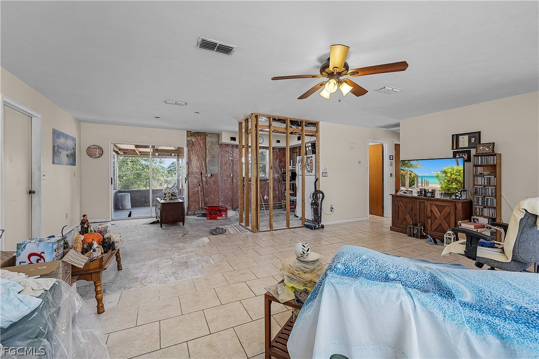 12170 Dolphin Road Bokeelia, FL 33922 - Photo 6 of 23 a bed room with a bed furniture and a window