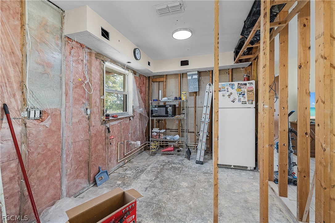 12170 Dolphin Road Bokeelia, FL 33922 - Photo 9 of 23 a view of a hallway with a livingroom