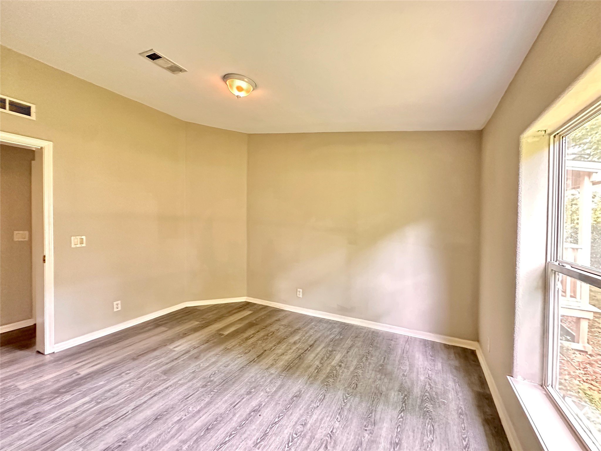 202 Main Street Fresno, TX 77545 - Photo 24 of 26 a view of room with window and wooden floor